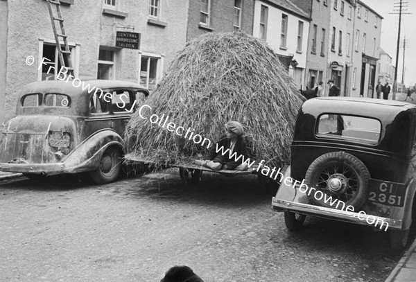STREET SCENE WITH LOAD OF HAY